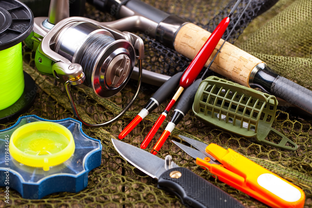 fishing tackle on a wooden table. toned image
fishing tackle on a wooden table. toned image