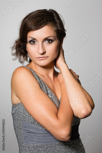 Attractive woman in a gray dress