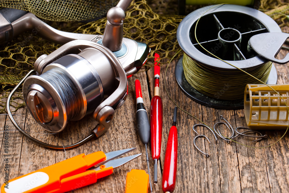fishing tackle on a wooden table fishing tackle on a wooden table