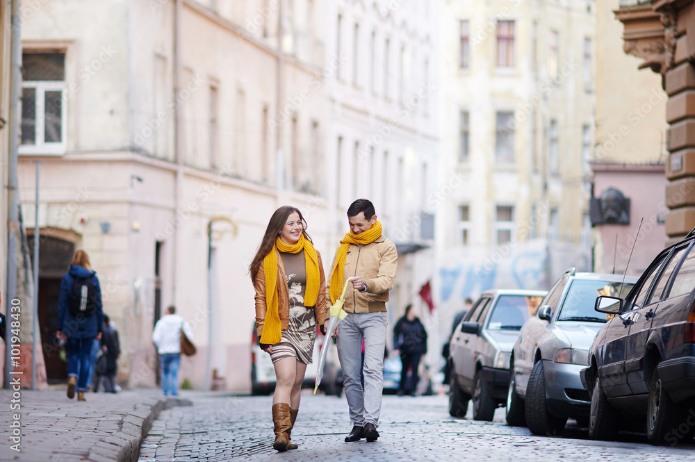 loving couple walking through the old city Lviv