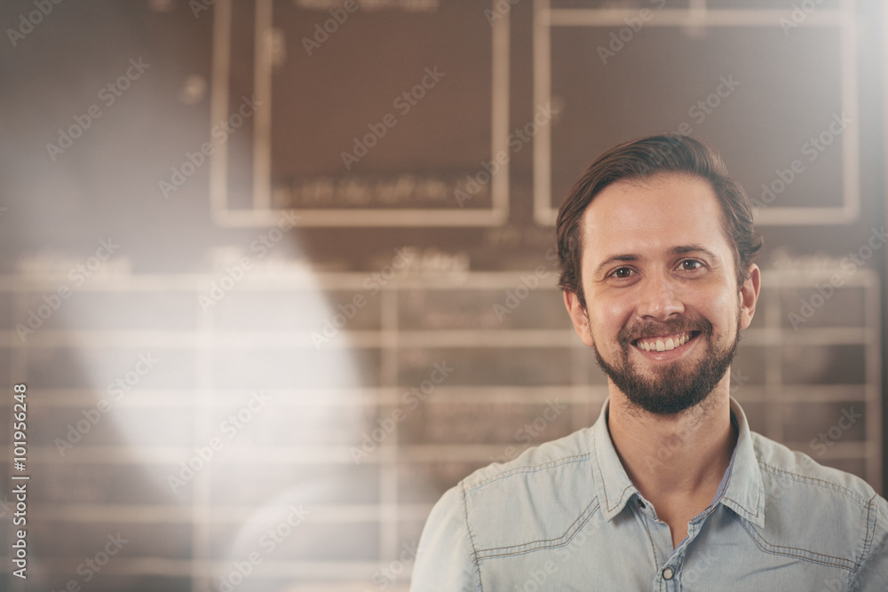 Smiling designer and craftsman in his studio Smiling designer and craftsman in his studio