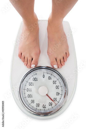Directly Above Shot Of Woman Standing On Weight Scale