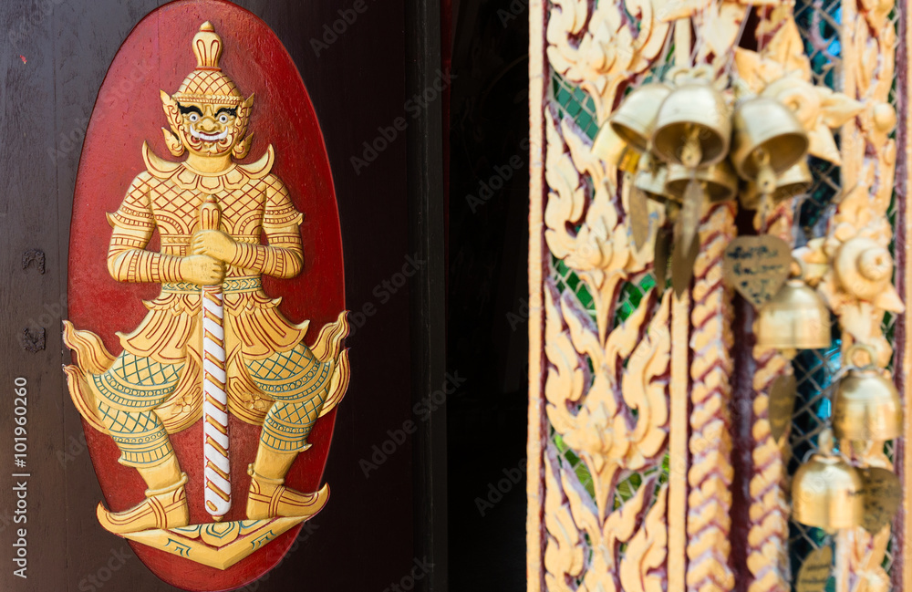 Wood carvings, gold giant on a red background in temple ,Thailand. this  is public carving so no need properties release.