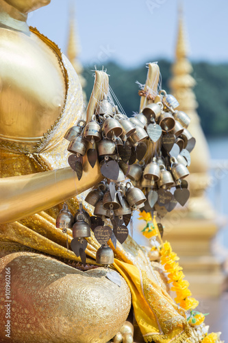 Wood carvings, gold giant on a red background in temple ,Thailand.