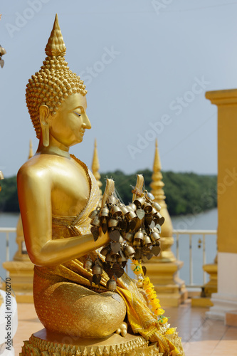 Wood carvings, gold giant on a red background in temple ,Thailand.