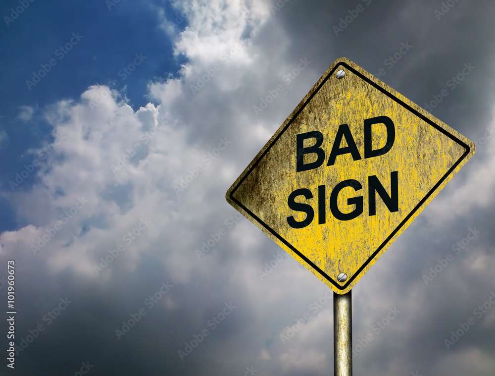 Bad Sign Road Sign with threatening darkening clouds in the sky background (Copyspace) Bad Sign Road Sign with threatening darkening clouds in the sky background (Copyspace)