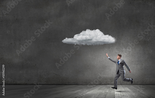 Businessman catch cloud