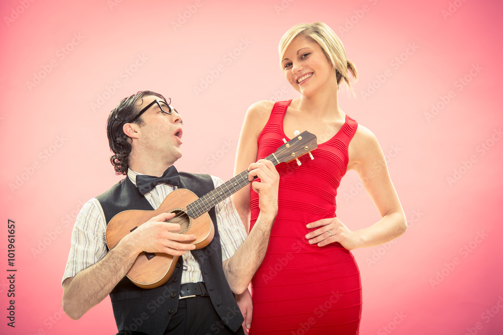 Nerd man boyfriend play ukulele love song for his girlfriend for valentine day