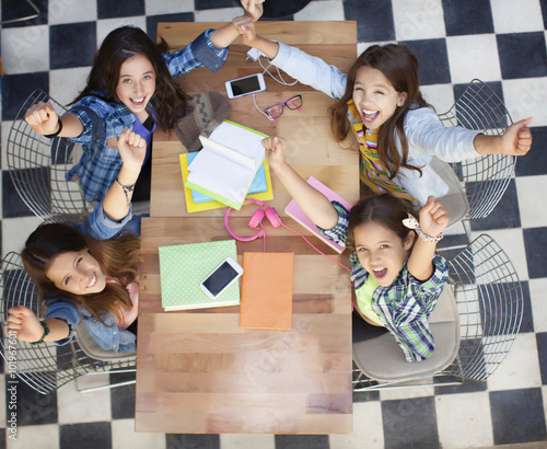 Teen students arms up  High View