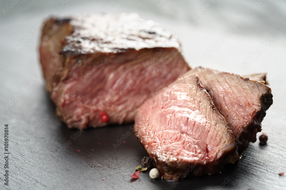 entrecote beef steak sliced on slate board