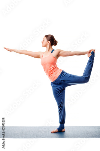 Woman doing yoga asana Natarajasana photo