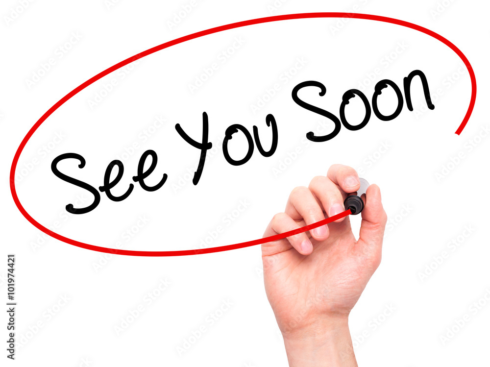 Man Hand writing See You Soon with black marker on visual screen Man Hand writing See You Soon with black marker on visual screen