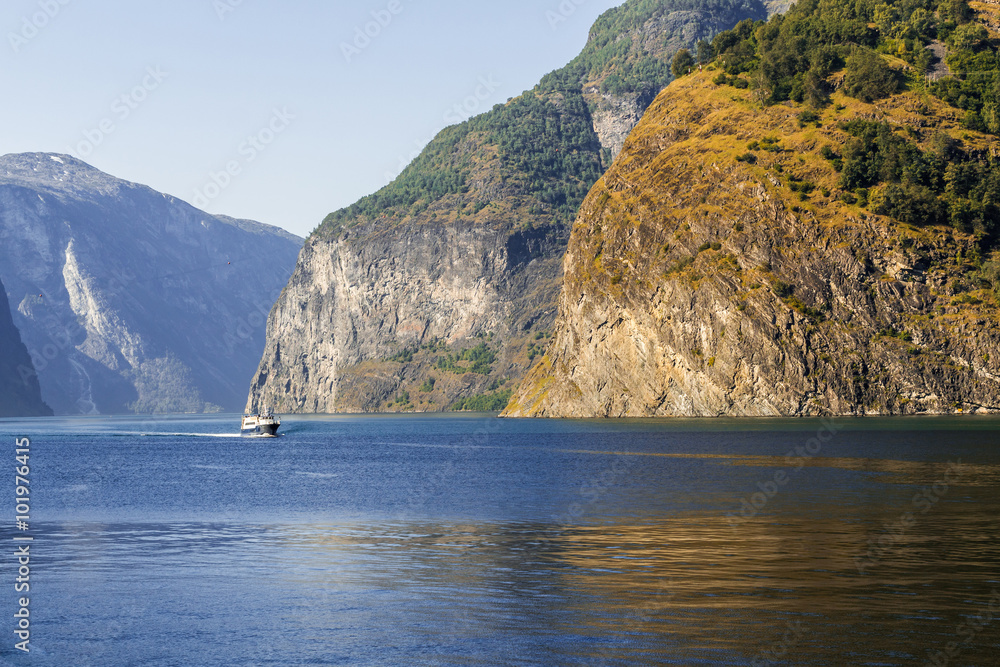 Norway fjord landscape with a little ship