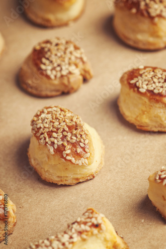 Fresh homemade salty scones with cheese and sesame