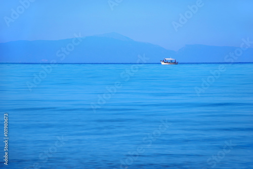 A white boat in the marine landscape © ednorog13