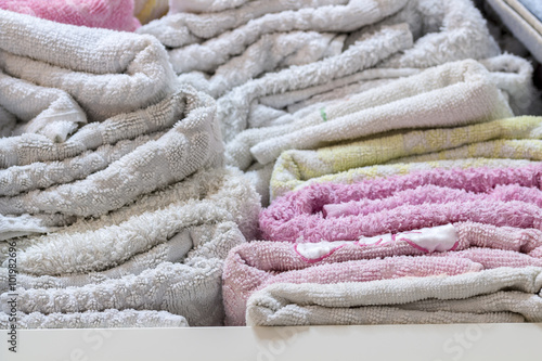 Close-up of towels in bathroom shelf