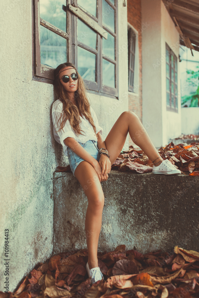 Summer lifestyle portrait hipster stylish women with fit sexy body, wearing  denim mini shorts and vintage sunglasses.going crazy, having fun, dancing,  laughing and screaming. Chilling Stock Photo | Adobe Stock