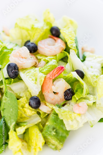 Green Salad with Shrimps on Light White Background, Healthy Eating Concept, Paleo Diet, Close-up, Vertical