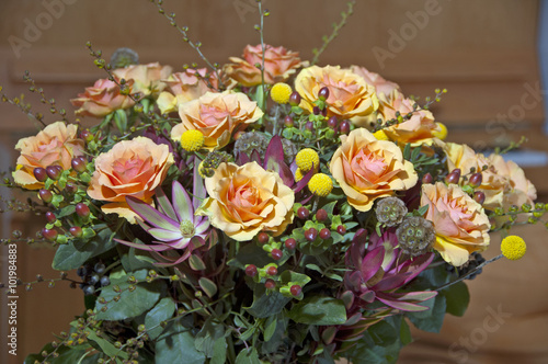 Bouquet with orange roses in vase