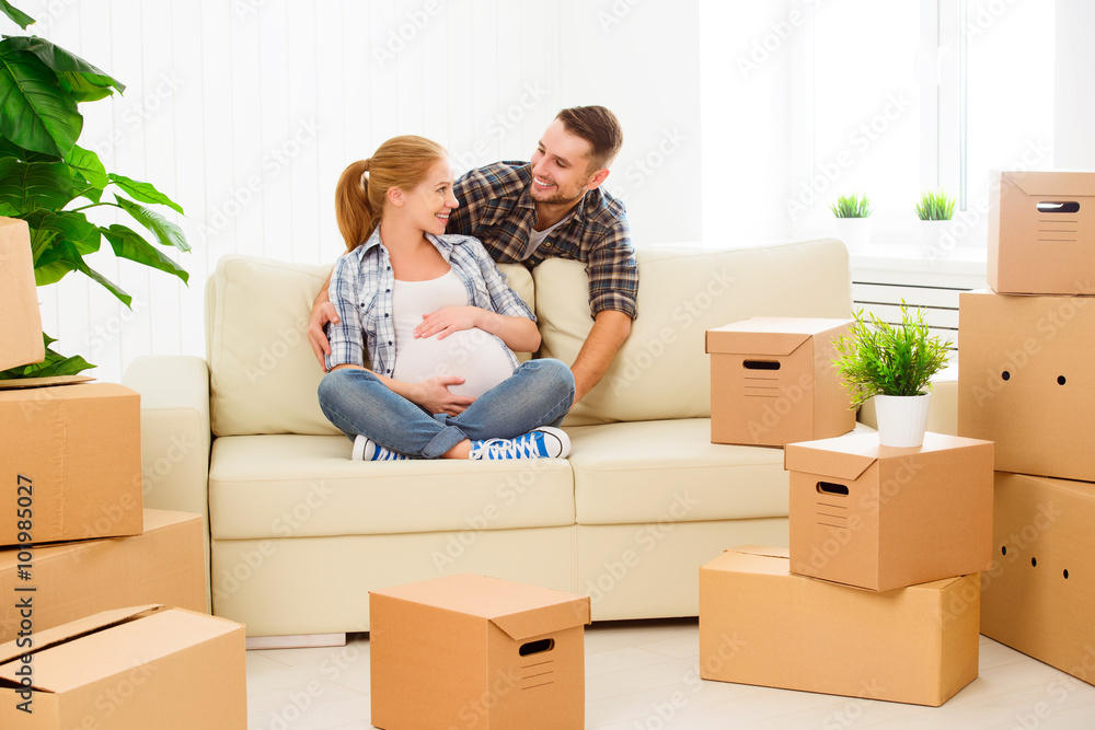 moving to new apartment. family pregnant wife and husband with moving to new apartment. family pregnant wife and husband with