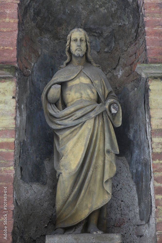 Historic Jesus on the mystery winter old Prague Cemetery, Czech Republic