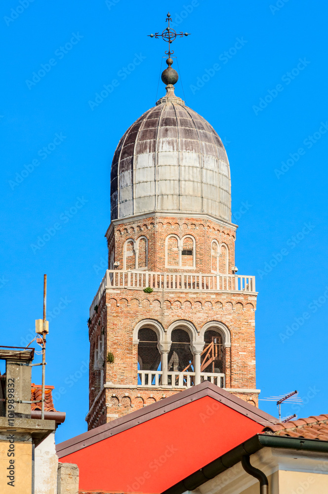 Details of old dome with crucifix in Chioggia