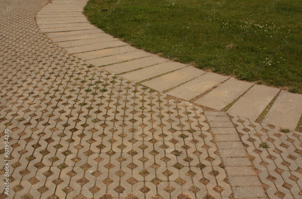 Fototapeta premium Pavement and green grass.