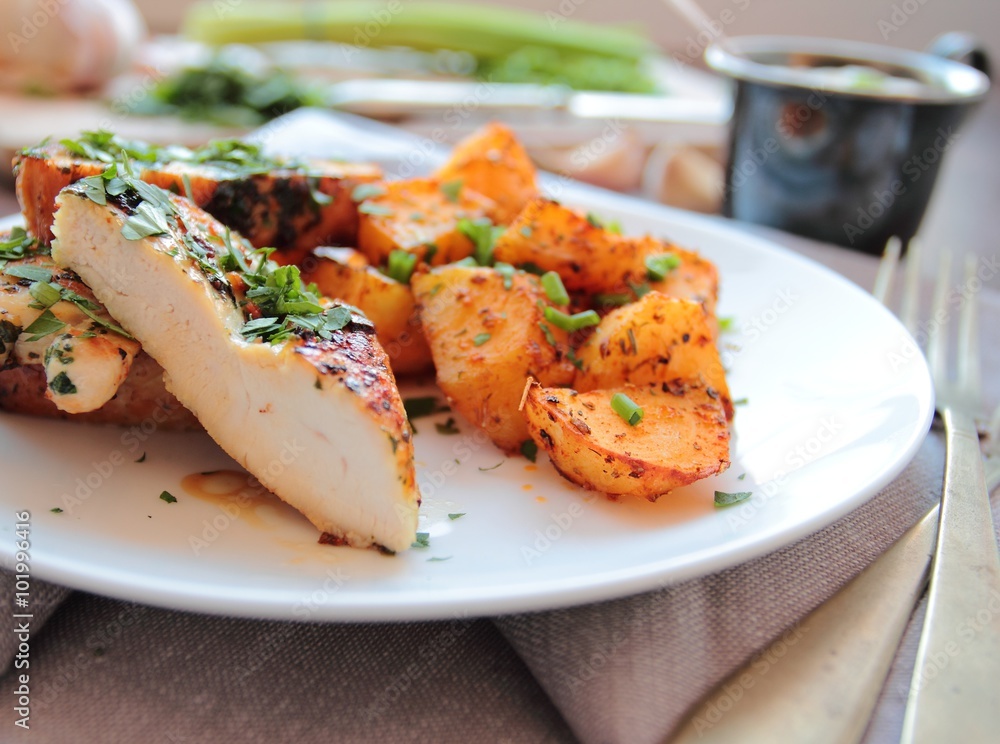 Chicken roasted in herbs with fried potatoes Chicken roasted in herbs with fried potatoes