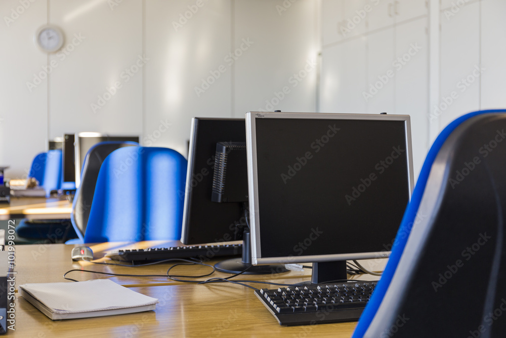 IT room with blue chairs an PC monitors IT room with blue chairs an PC monitors