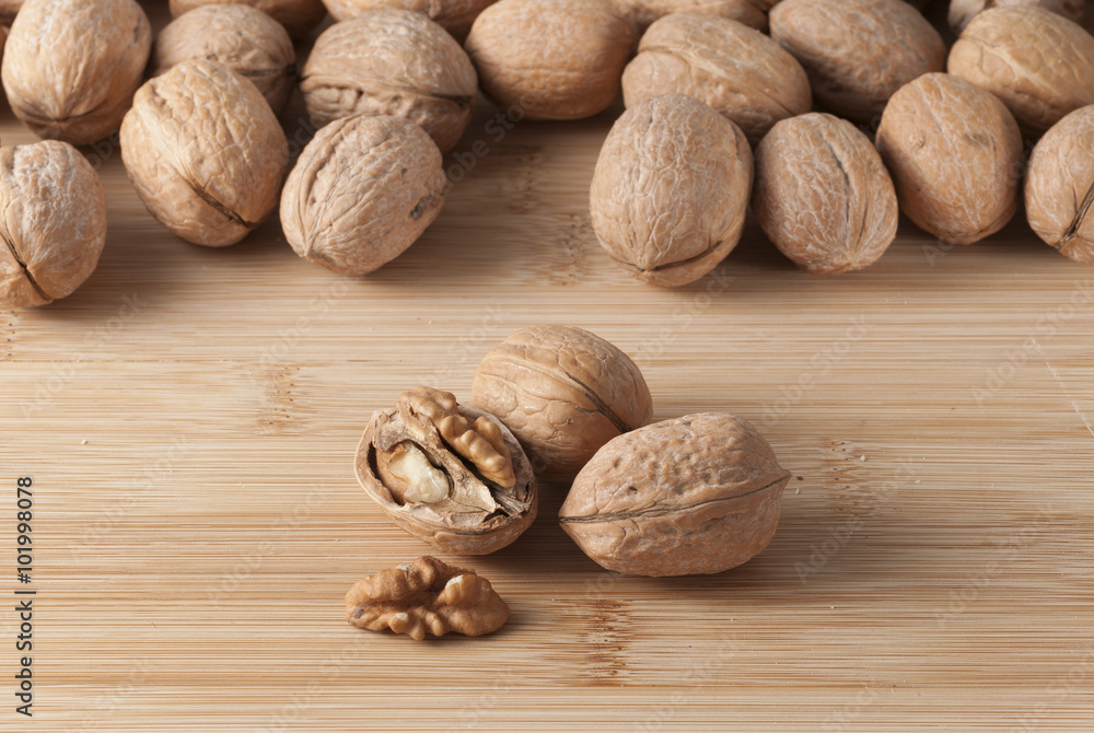 pile of walnuts in the foreground represent a healthy diet pile of walnuts in the foreground represent a healthy diet