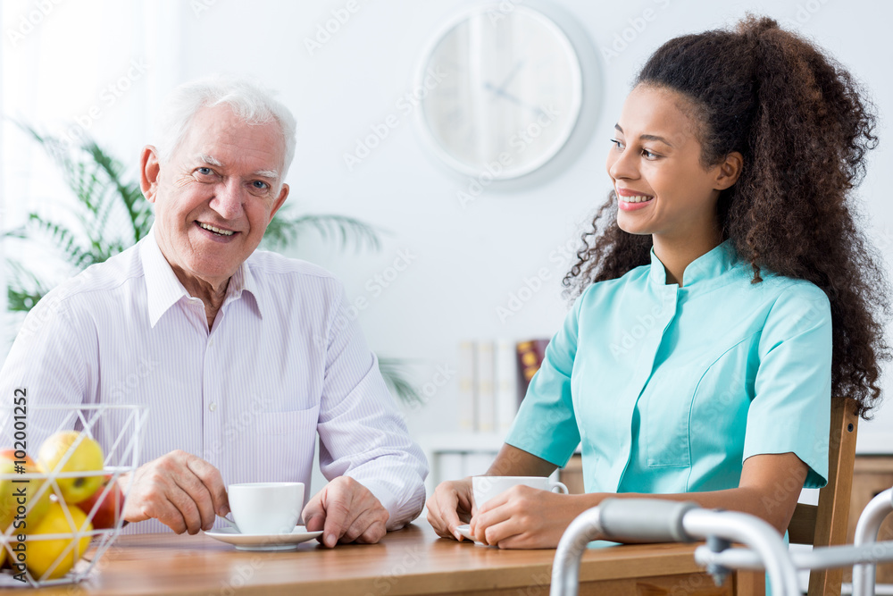 Fototapeta premium Positive carer and retired man