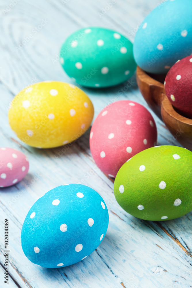 Obraz premium colored Easter eggs on wooden background