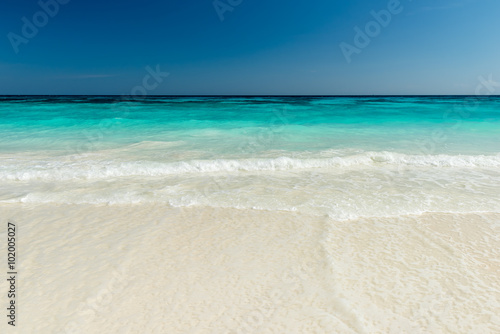 Beautiful beach and tropical sea, Wave of the sea on the sand beach © yotrakbutda