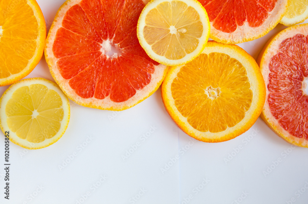 Citrus fruit background with a group of oranges lemons lime tangerines and grapefruit Citrus fruit background with a group of oranges lemons lime tangerines and grapefruit