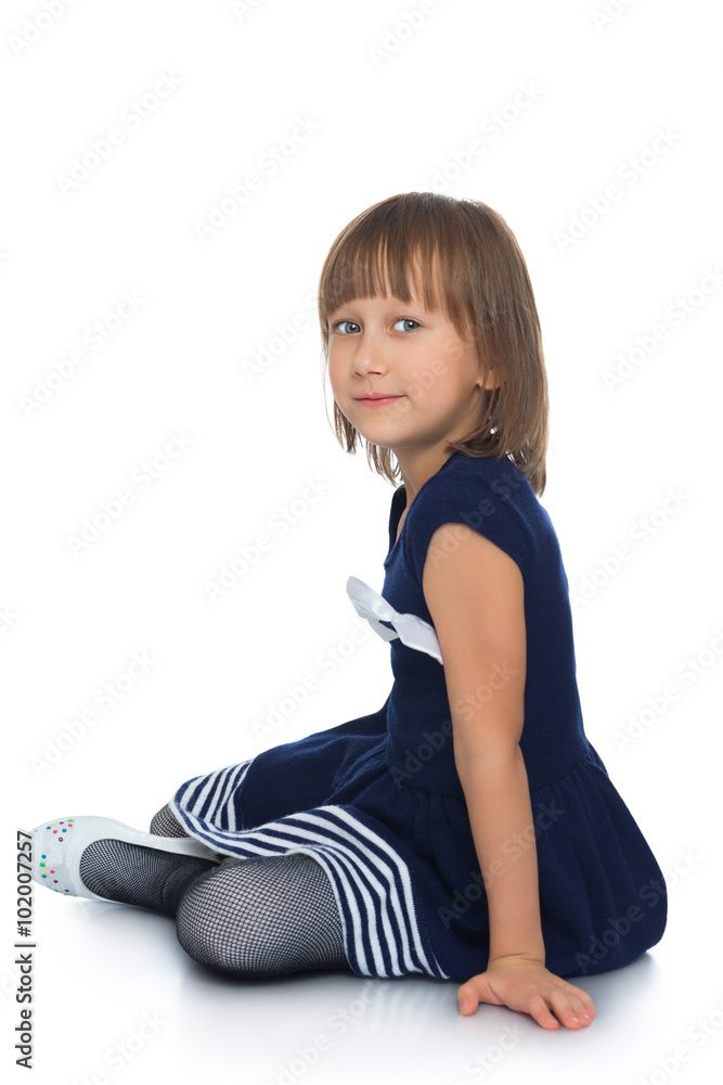 The child sits on the floor The child sits on the floor