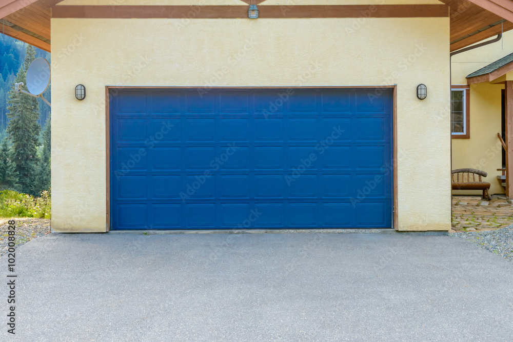 Fototapeta premium Fragment of a luxury house with a double garage door in Vancouver, Canada.