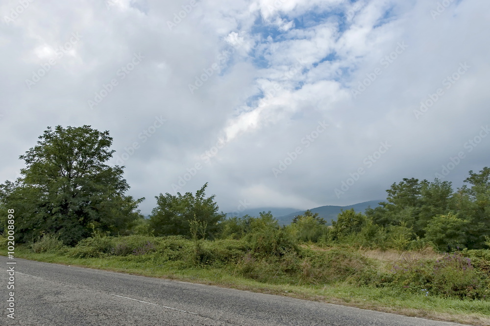 Fototapeta premium Picturesque road through Balkan mountain in cloudy day, Petrohan, Bulgaria 