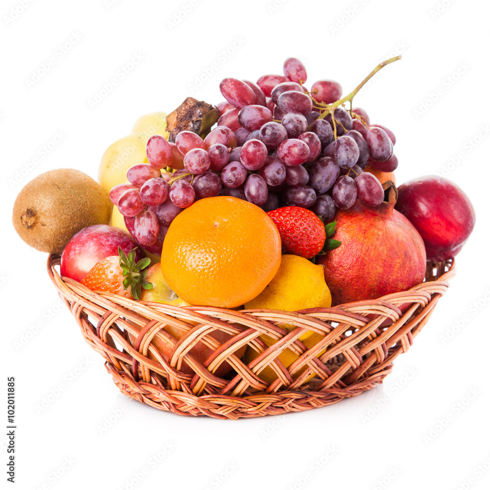 Fruits in the basket. assorted fruits in wicker basket Fruits in the basket. assorted fruits in wicker basket