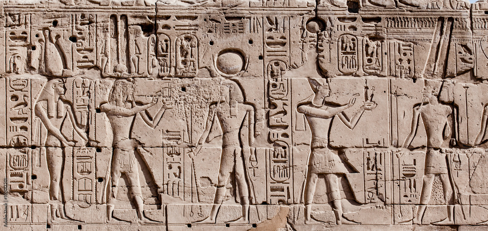 Egyptian hieroglyphs. Hieroglyphic carvings on a wall