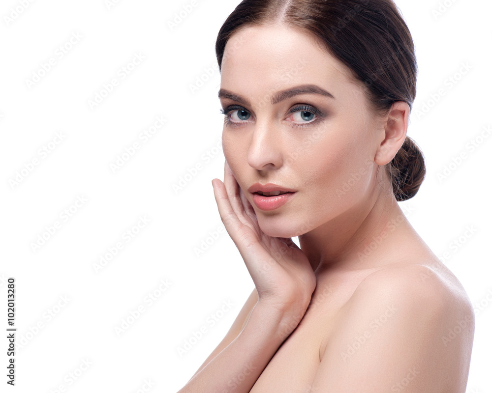 Beauty Woman Face closeup. Beautiful brunette young spa model girl with perfect skin. Skin care concept. Fresh Clean Skin. Portrait of female looking at camera and smiling. Beige background