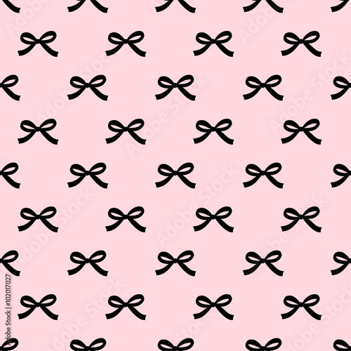 Seamless beauty bow pattern on pink background. Cute fashion illustration. Decorative background.