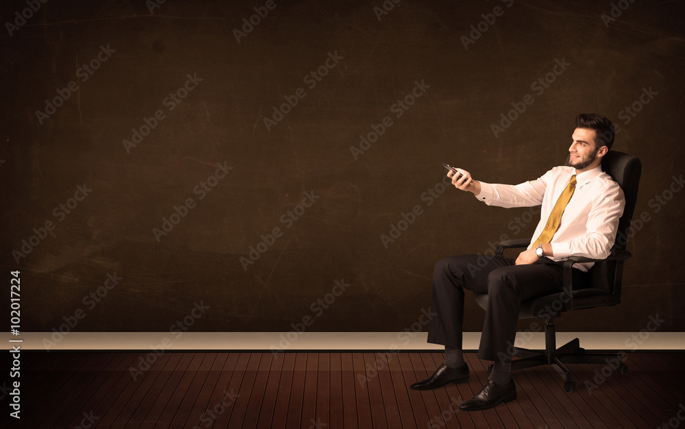 Businessman holding high tech tablet on background with copyspac Businessman holding high tech tablet on background with copyspac