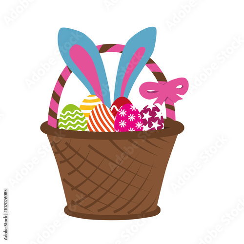 Easter rabbit in basket full of decorated easter eggs