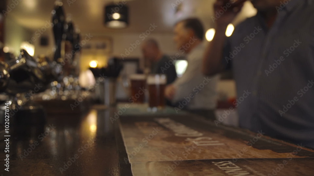 Bartender Pulling A Pint In A British Pub Bartender Pulling A Pint In A British Pub