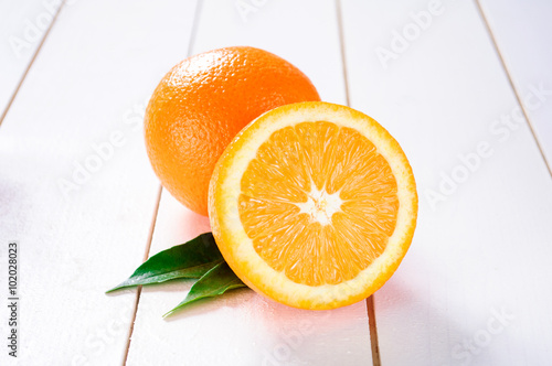 Orange fruit on white table