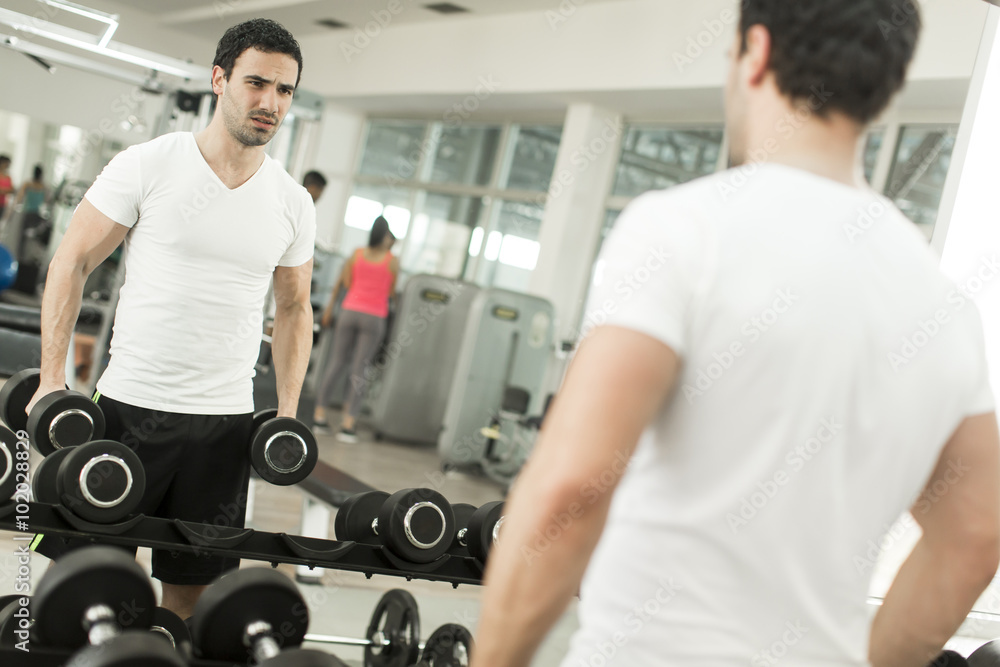 Young man training in the gym Young man training in the gym