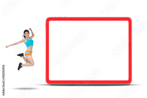 Woman Jumping near The Empty Board © Creativa Images