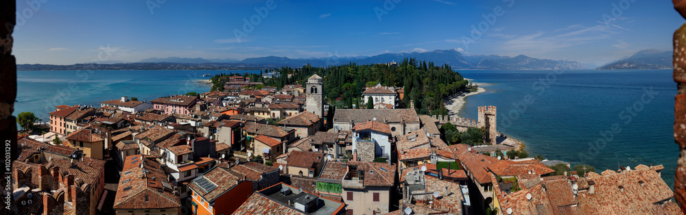 Lake Garda, Sirmione, Dolomites in Italy. Beautiful panoramic view on Lake Garda, Sirmione and Italian Alps from Scaliger Castle (Lombardy, Italy).