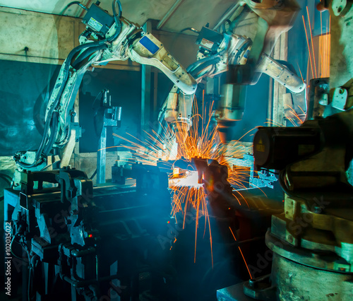 Welding robots movement in a car factory