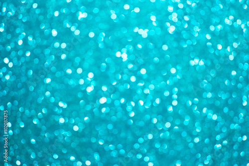 Festive blur blue glitter bokeh background